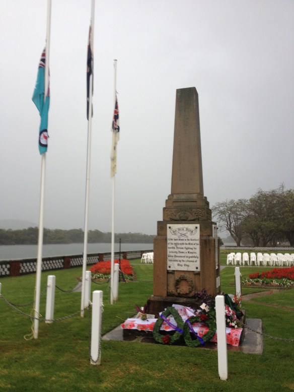 Grey skies, flags at half mast, the seats used by the early risers, and the wreaths of flower at the Woy Woy epitaph.