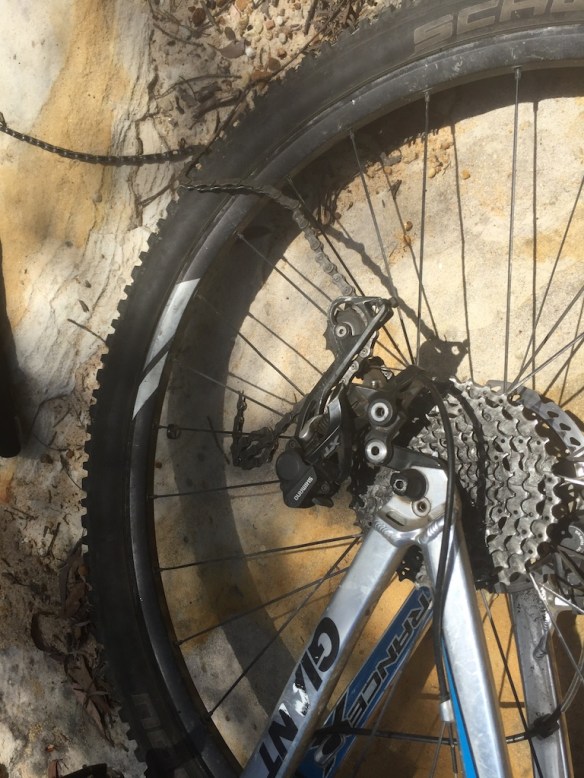 Pushing up a steep little rock ledge I heard a "clunk" behind me then the ceasing of rolling wheels, Yep, Paul's "strongest ever" chain had snapped under the harsh rock garden conditions (again)! 